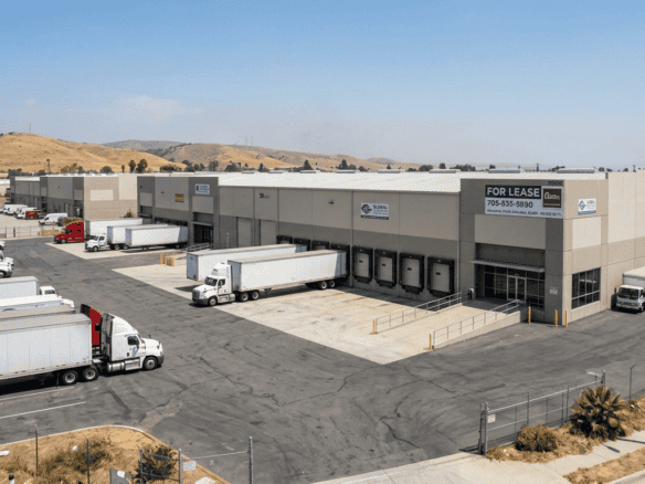 Industrial warehouse buildings in the San Fernando Valley with loading docks and truck court, typical of Los Angeles industrial space for lease